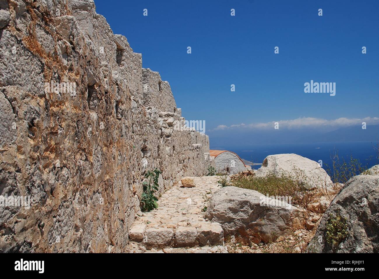 The remains of the medieval Crusader Knights castle above Chorio on the Greek island of Halki. Stock Photo