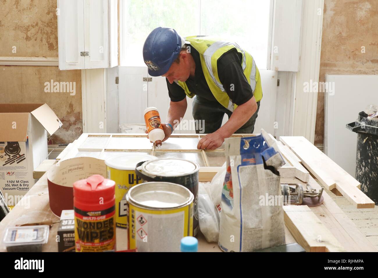 Ongoing renovations of No.131  on The Promenade by The Lucky Onion Group and Dowdeswell Estates - Josh Burke restoring a original sash window - 25.4.2 Stock Photo