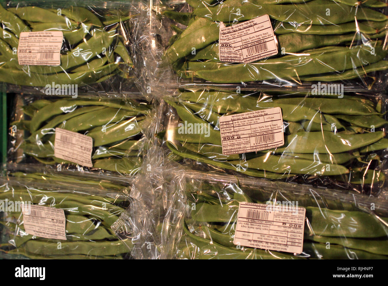 Beans packed in plastic bags on a supermarket Stock Photo