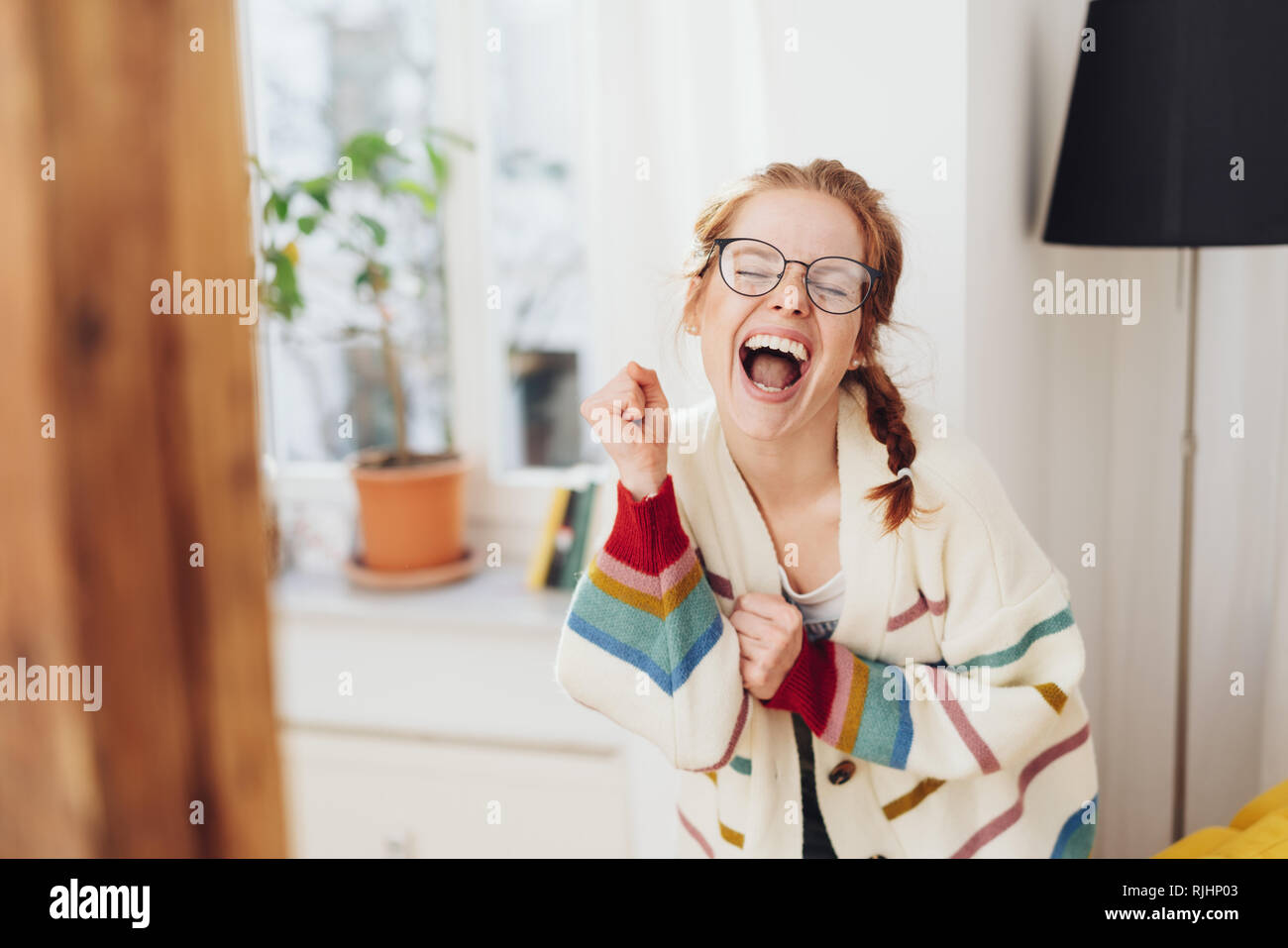 Very Happy Cute Young Girl With Pigtails Singing Or