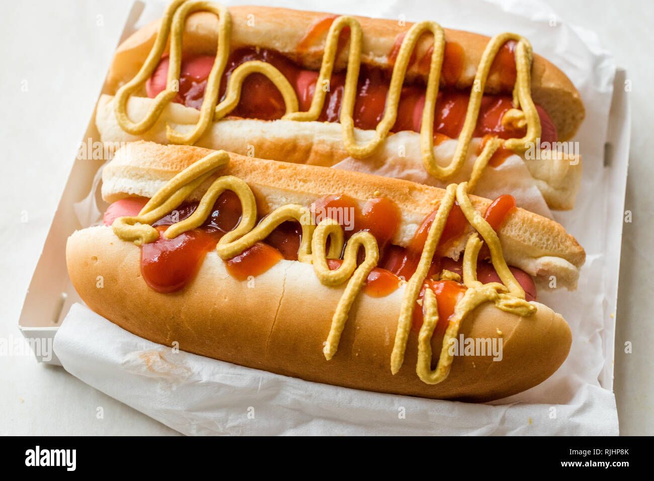 Box of Hot Dog with Ketchup and Mustard / Sausage Sandwich. Fast Food