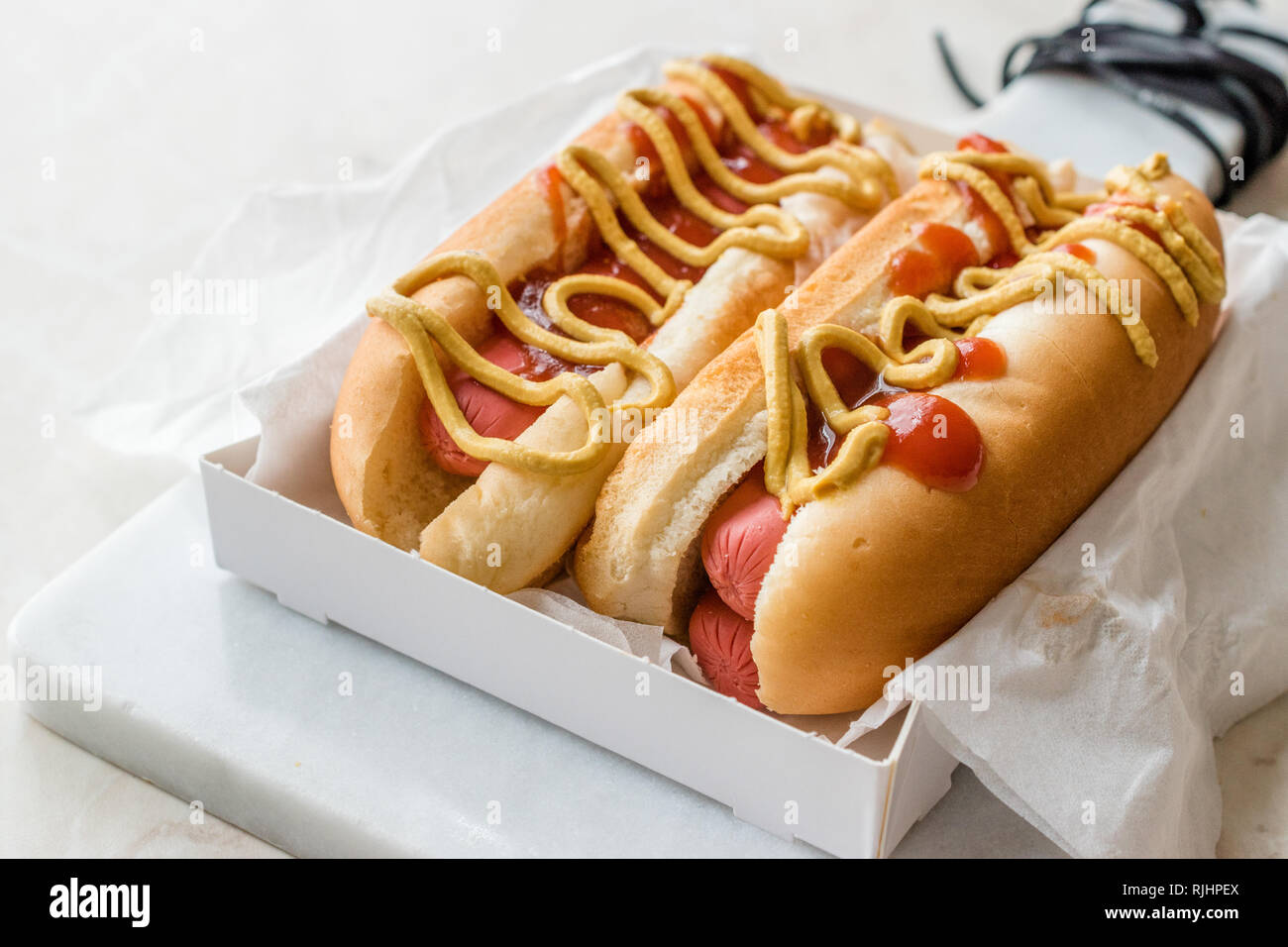 Box of Hot Dog with Ketchup and Mustard / Sausage Sandwich. Fast Food