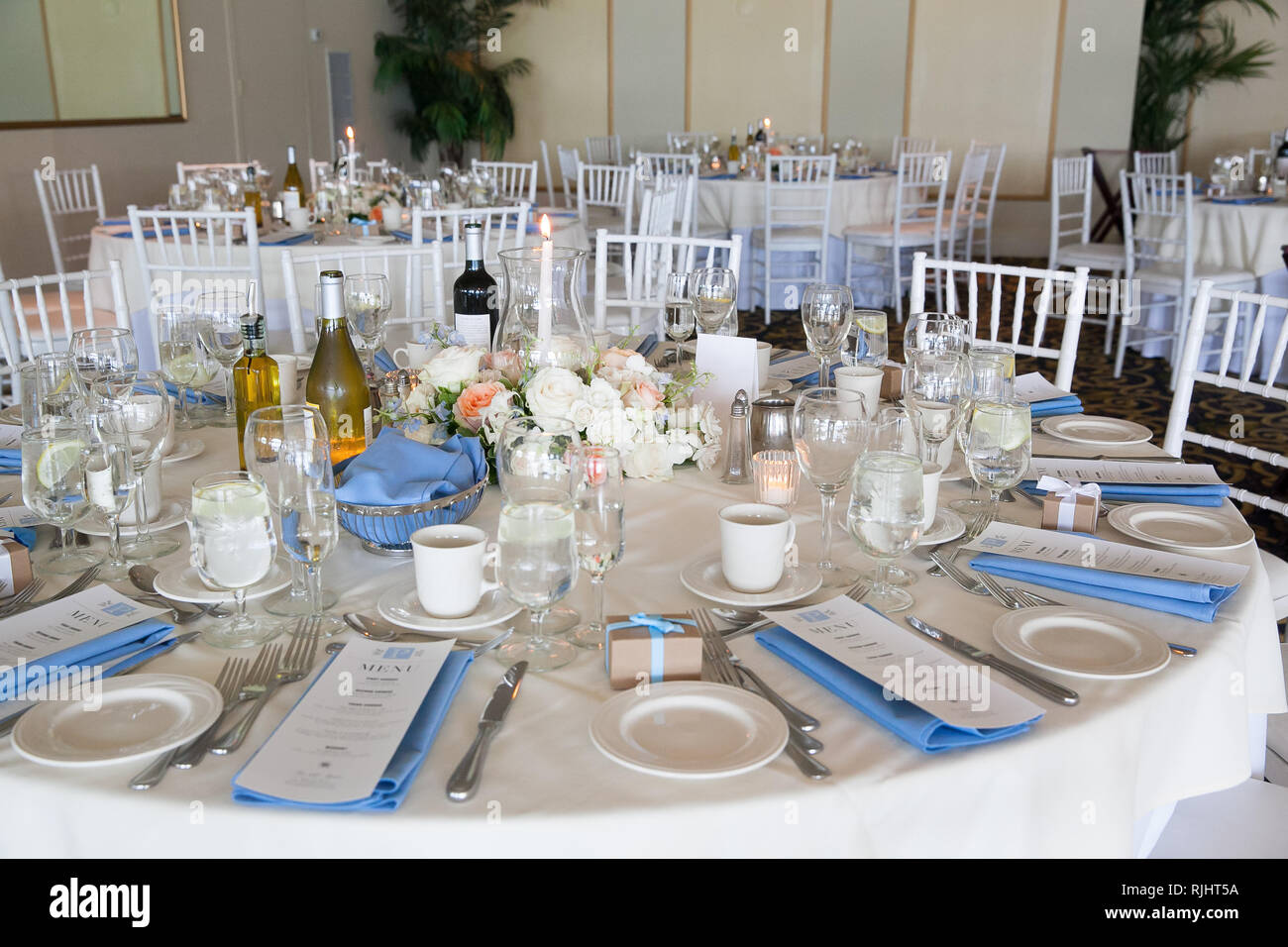 Wedding table decoration series - tables set for beautiful indoor catered  luxury wedding event with blue Stock Photo - Alamy