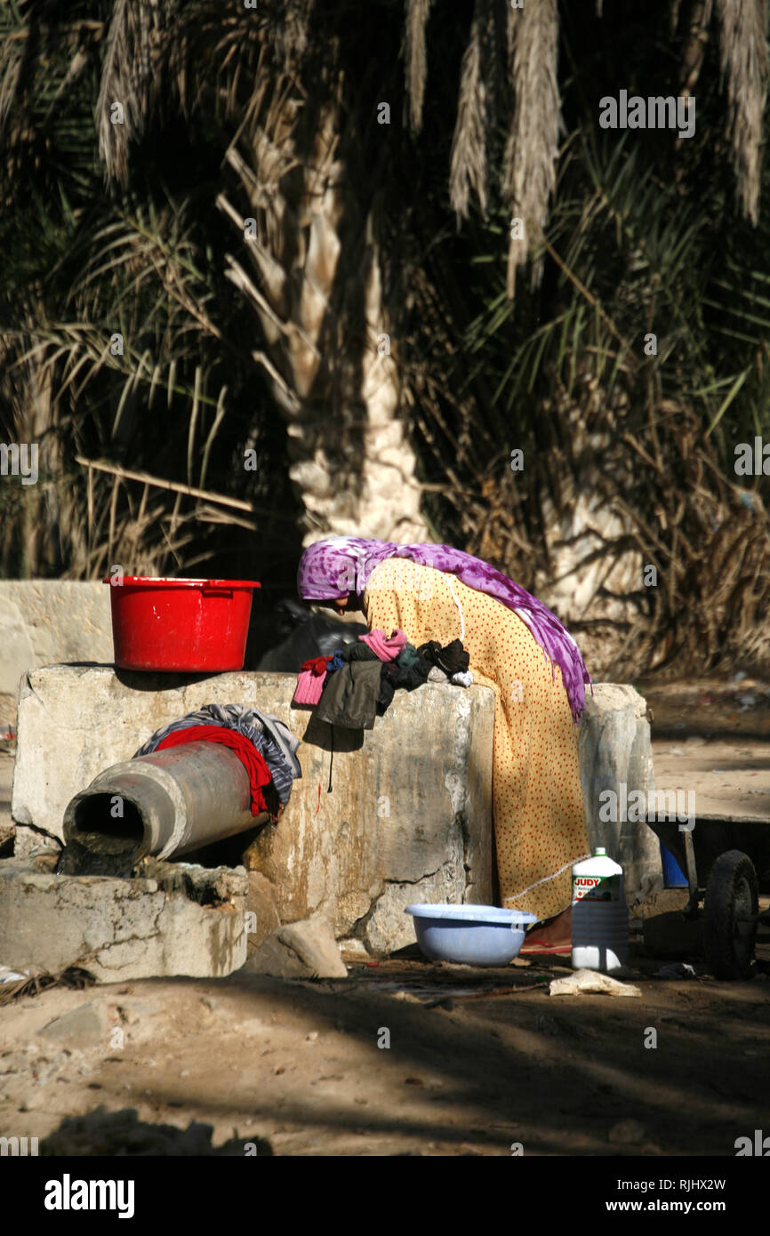 Women with a laundry at the well of Douz Stock Photo