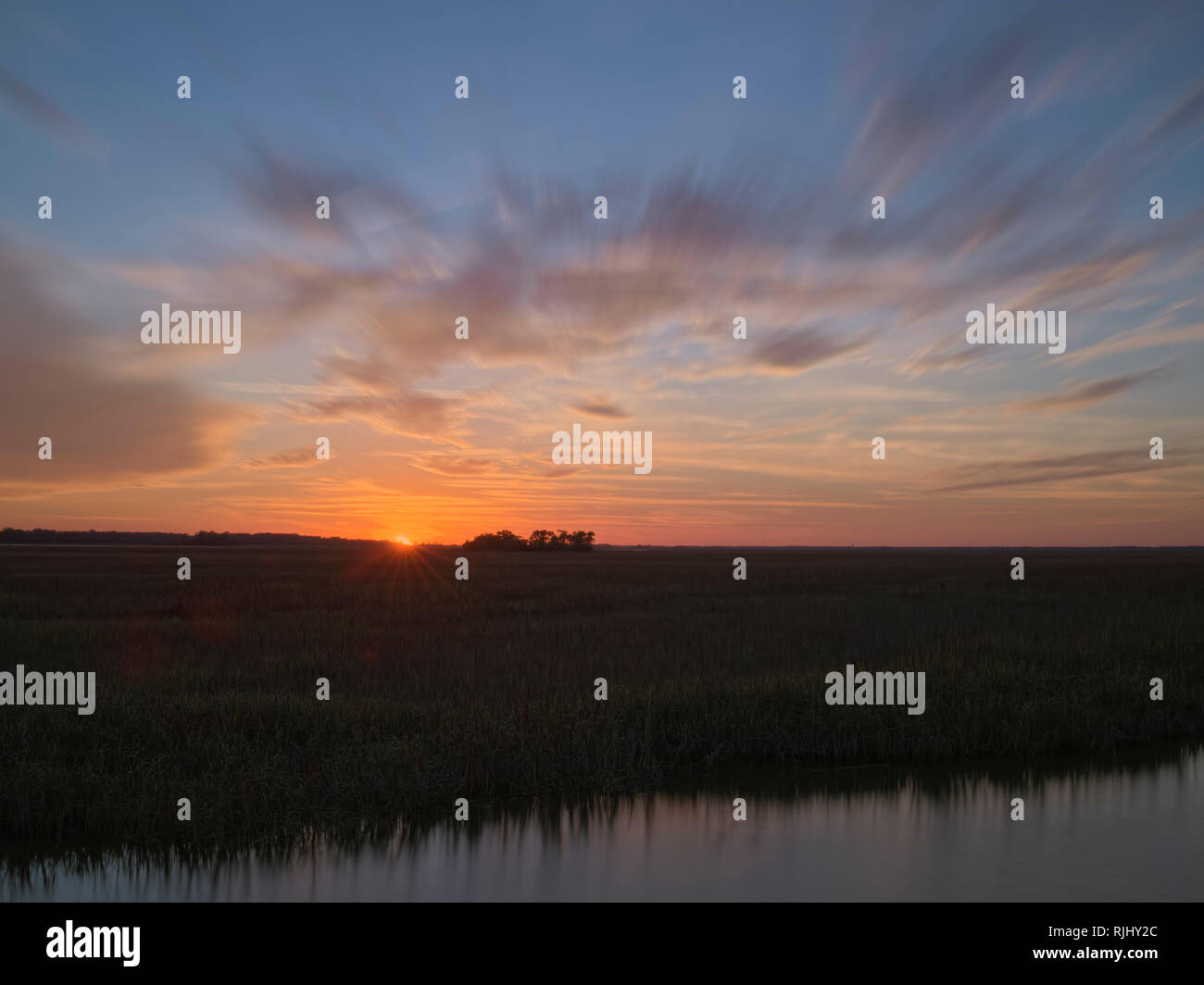 Hunting Island State Park, South Carolina. Marsh Boardwalk Trail area. Sunset view over marsh. Stock Photo