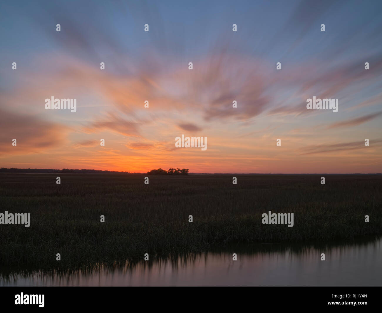 Hunting Island State Park, South Carolina. Marsh Boardwalk Trail area. Sunset view over marsh. Stock Photo