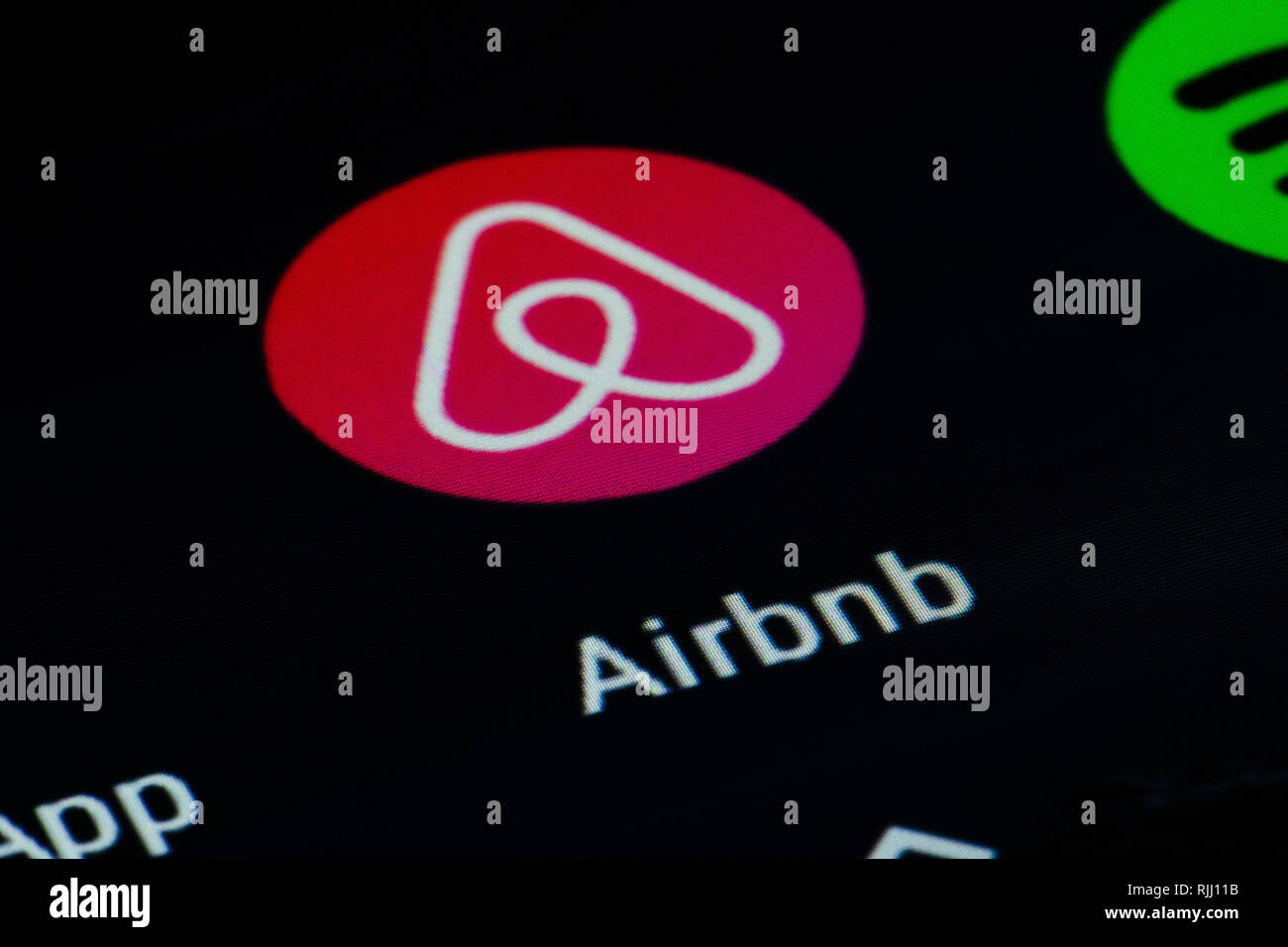 Airbnb app, privately held global company that operates an online marketplace and hospitality service which is accessible via its websites Stock Photo
