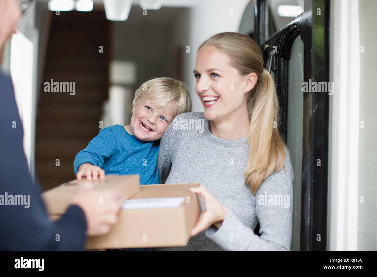 Young family receiving a home delivery Stock Photo