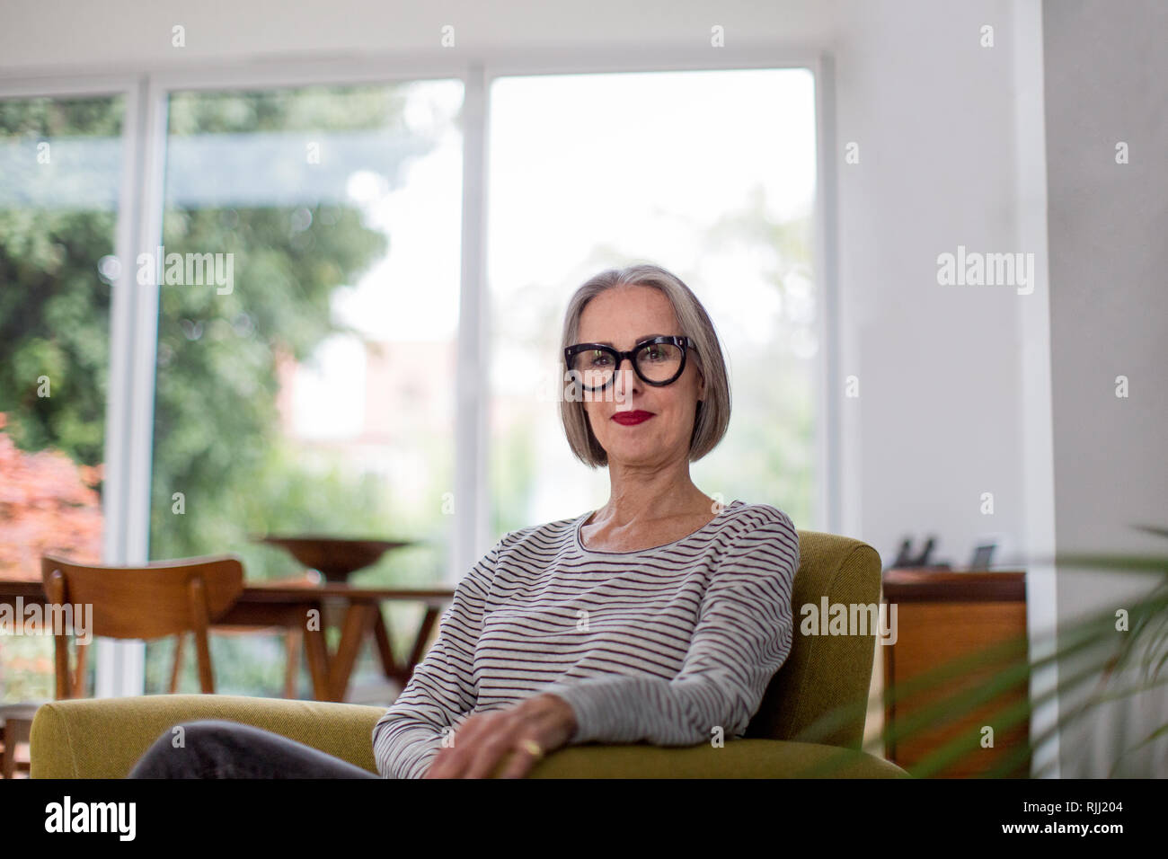 Portrait of a mature adult female at home Stock Photo