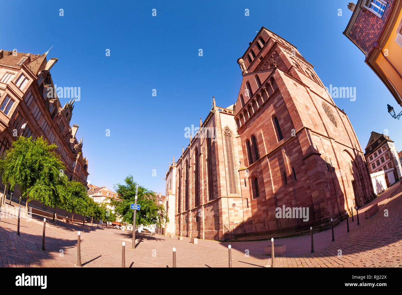 Low-angle view of Saint Thomas hall church against blue sky, Strasbourg, France Stock Photo