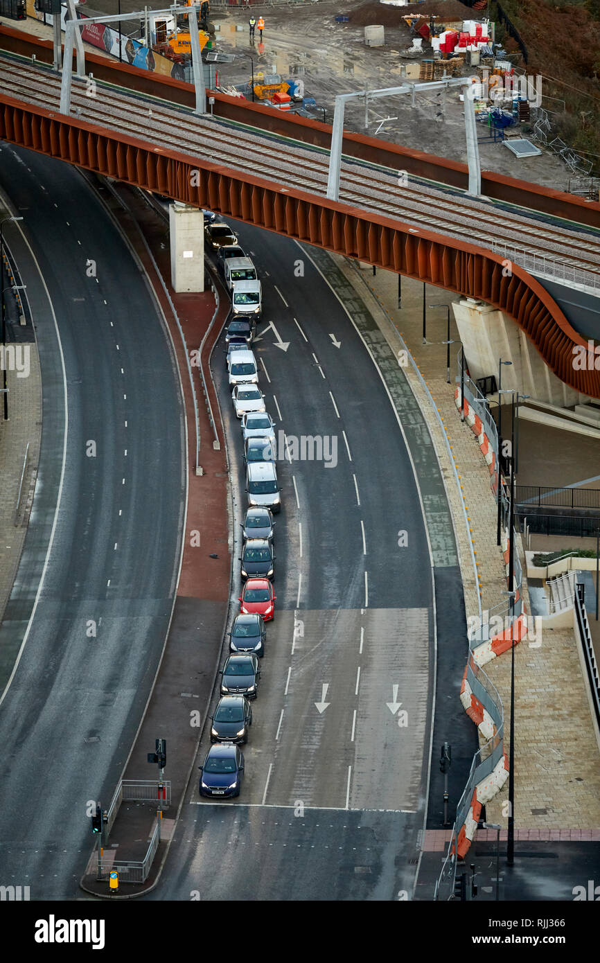 Looking down on queuing car traffic passing under the Ordeal Cord bridge along Trinity Way on the Manchester, Salford boundary Stock Photo