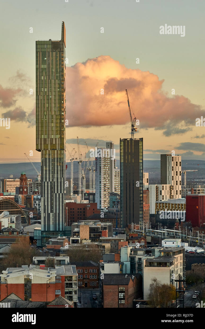 Manchester city centre skyline view across the rooftops from Salford