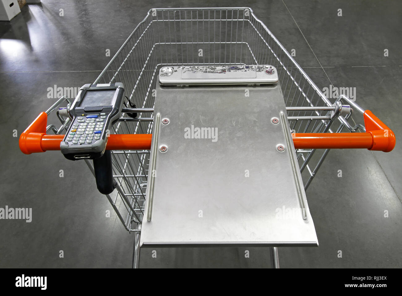 Shopping trolley with portable barcode scanner device Stock Photo Alamy