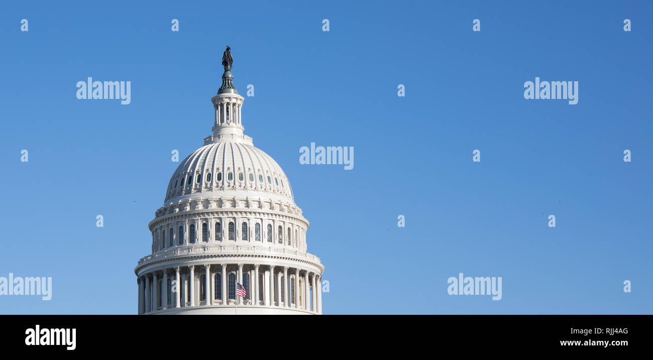 The Capitol Building rotunda in Washington, D.C. with a bright blue sky ...