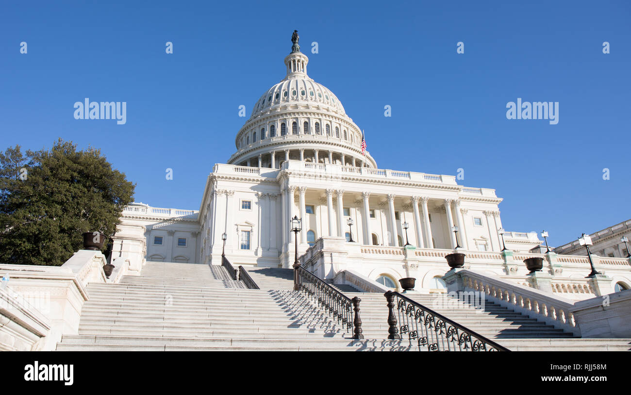 Back steps of the US Capitol Building in Washington, D.C. with a bright blue sky. Stock Photo