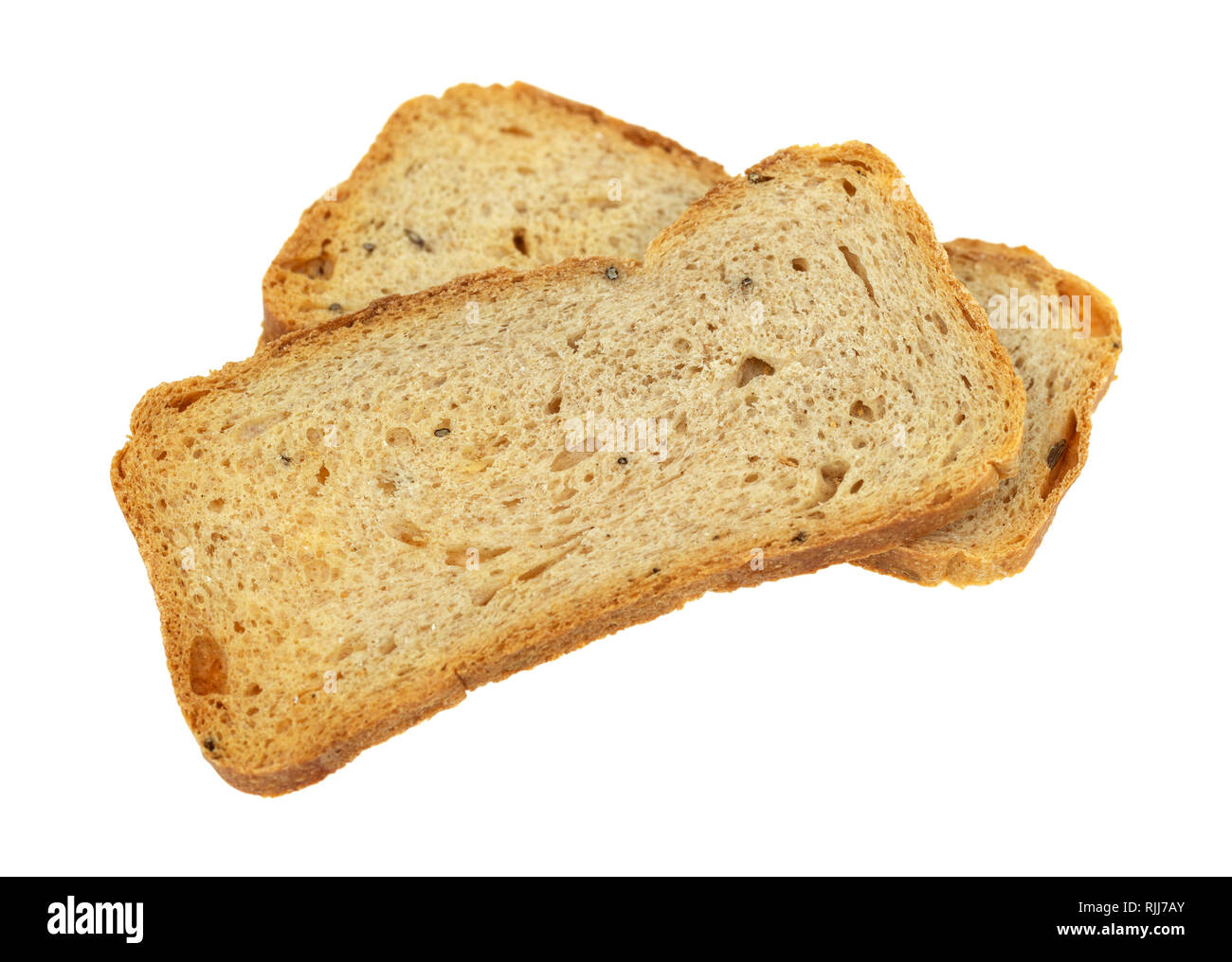 Side view of two slices of rye melba toast isolated on a white