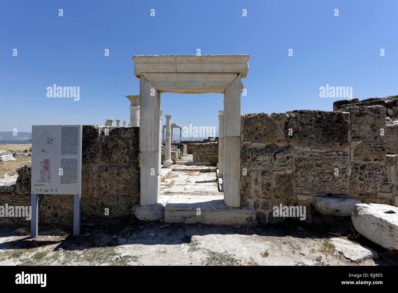 The doorway of the Clubhouse of the Greens, Laodicea, Denizli, Turkey. The building is dated to the early Byzantine period and a Greek inscription on  Stock Photo