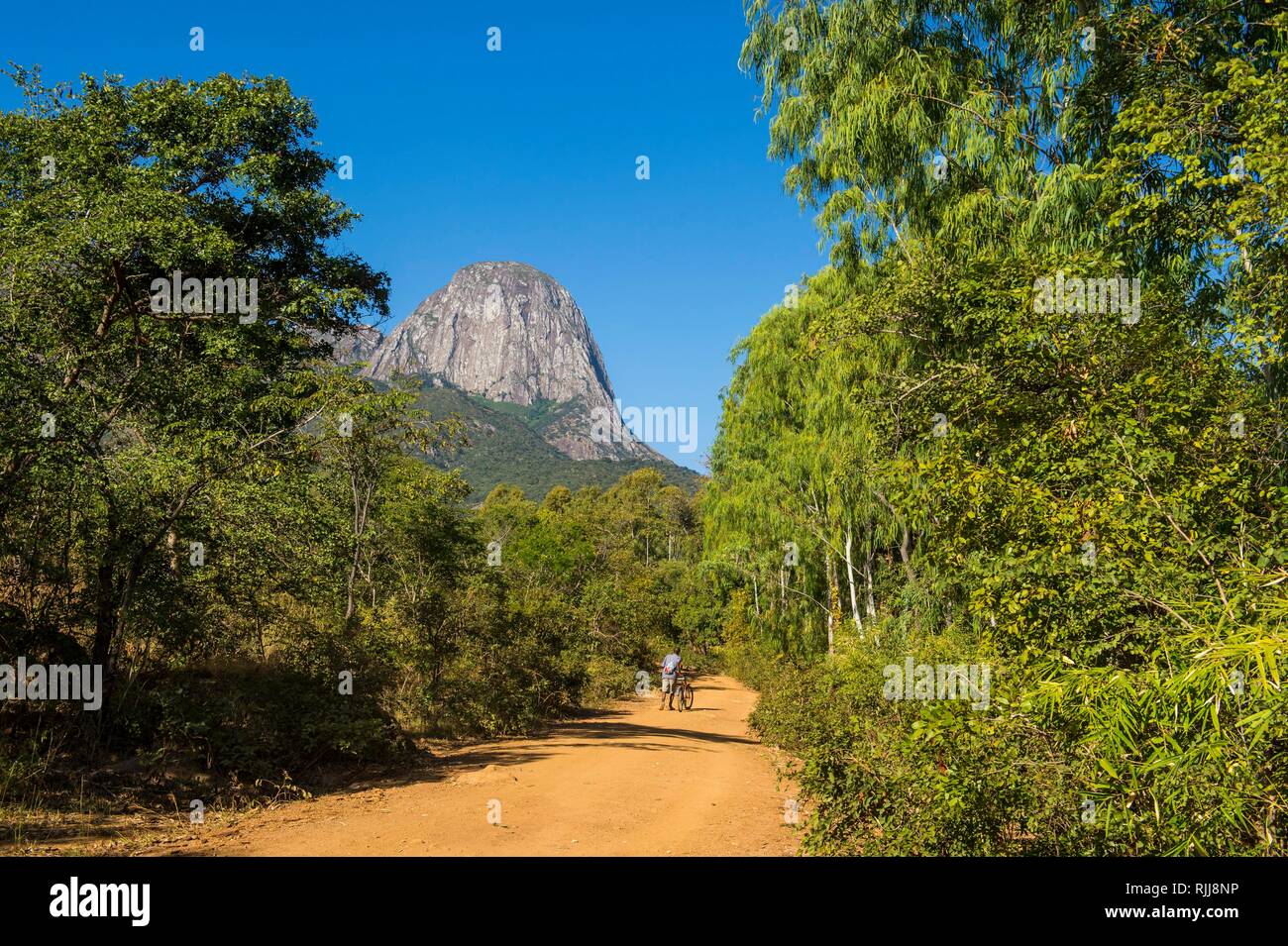 Dusty track laeding to the granite peaks of Mount Mulanje, Malawi Stock Photo