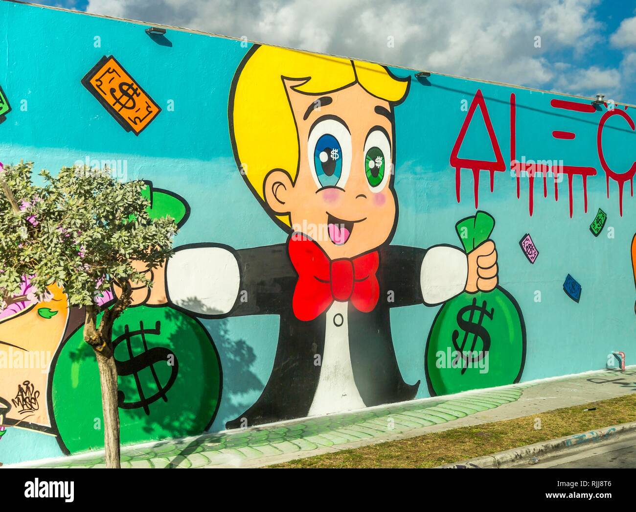 Street Art, Graffiti, Male with Dollar Money Bags, Wynwood Art District, Wynwood, Miami, Miami-Dade County, Florida, USA Stock Photo