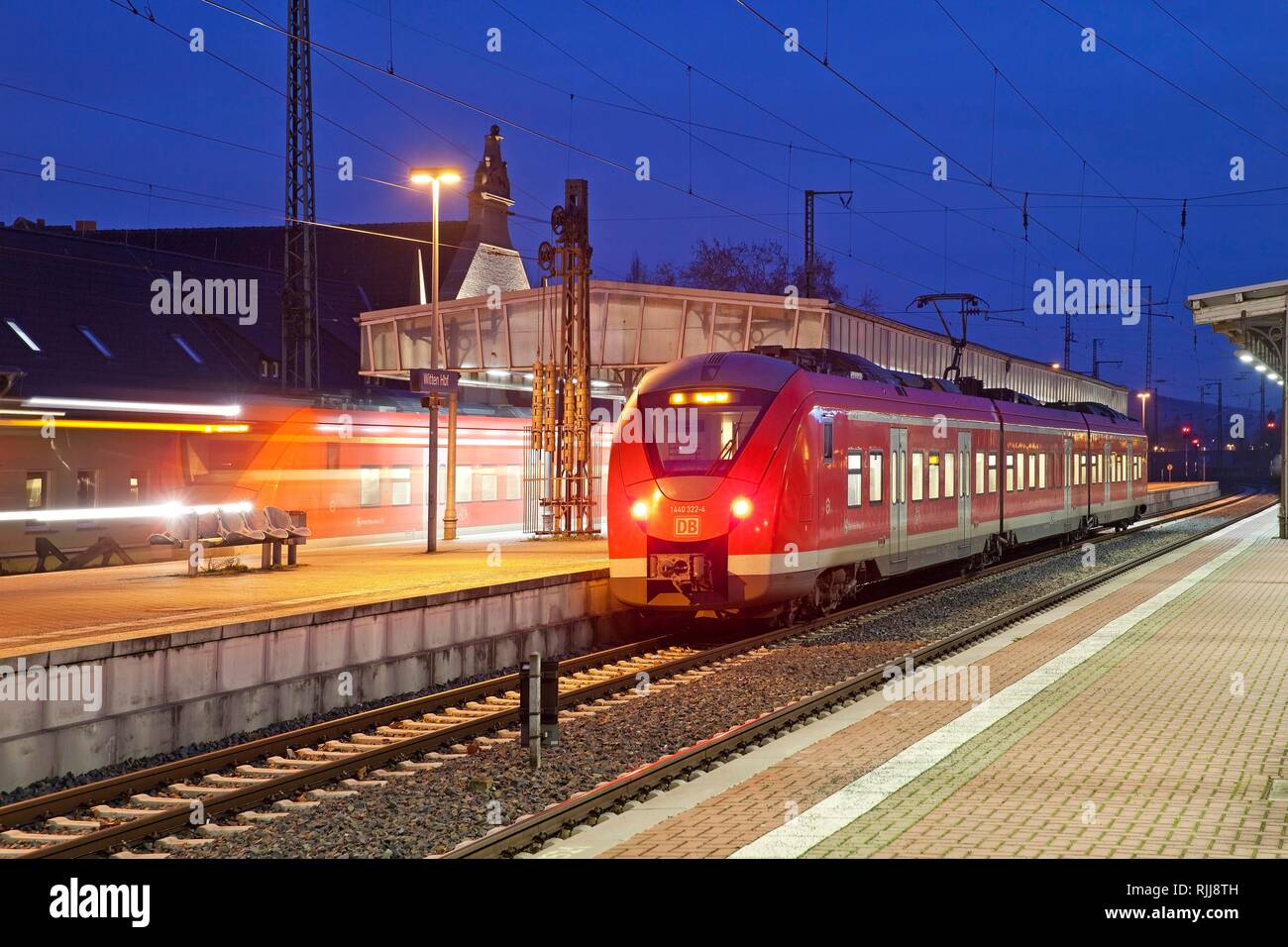 Local trains at the main station in the evening, Witten, Ruhr area, North Rhine-Westphalia, Germany Stock Photo