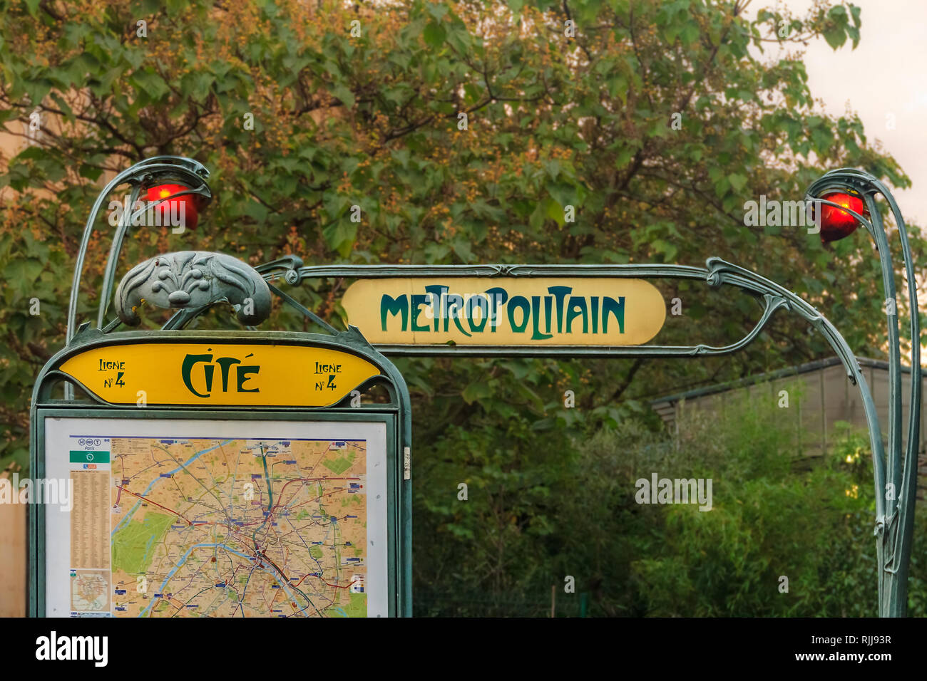 Ornate art deco or art nouveau Parisian metro sign with a map fragment at the Ile de la Cite stop near the Notre Dame de Paris cathedral in Paris Fran Stock Photo