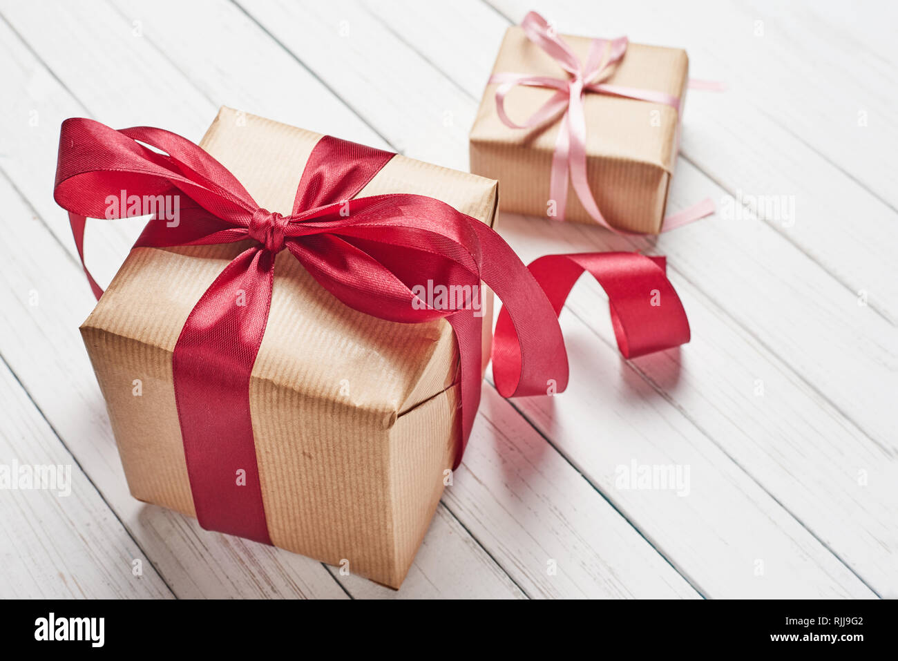 Gift boxes with red bow on white background, copy space Stock Photo - Alamy