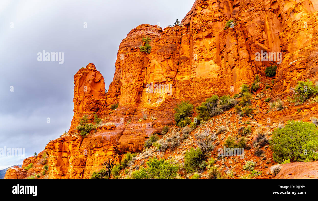 Rain pouring down on the geological formations of the red sandstone buttes surrounding the Chapel of the Holy Cross at Sedona in northern Arizona, USA Stock Photo