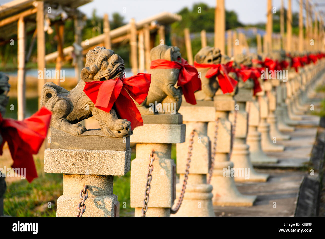 Row of Lion stone carving of Chinese god Shrine at Shrine Xian Dai Lo Tian Gong, a new tourist attraction Chinese temple landmark in Samut Prakan, Tha Stock Photo