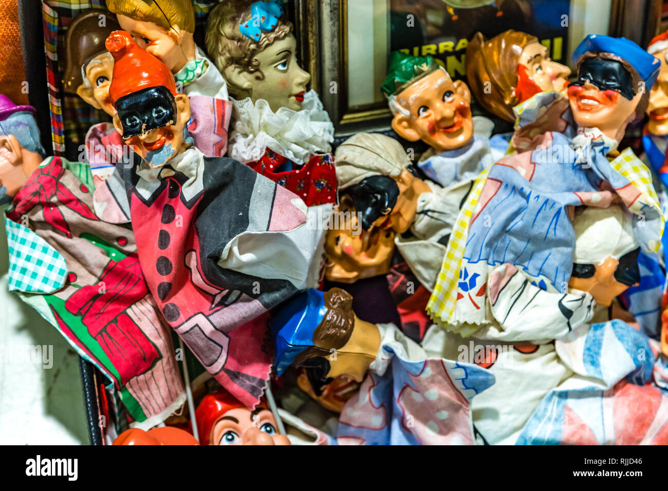 CESENA, ITALY - NOVEMBER 18, 2018: lights are enlightening Italian hand puppets for sale in Antiques Fair Stock Photo