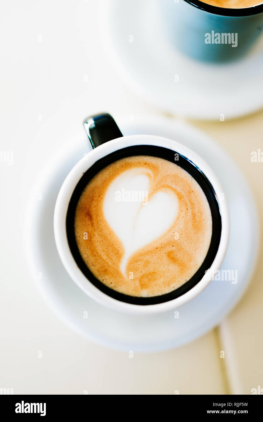 Small coffee with heart pattern in a retro cup Stock Photo - Alamy