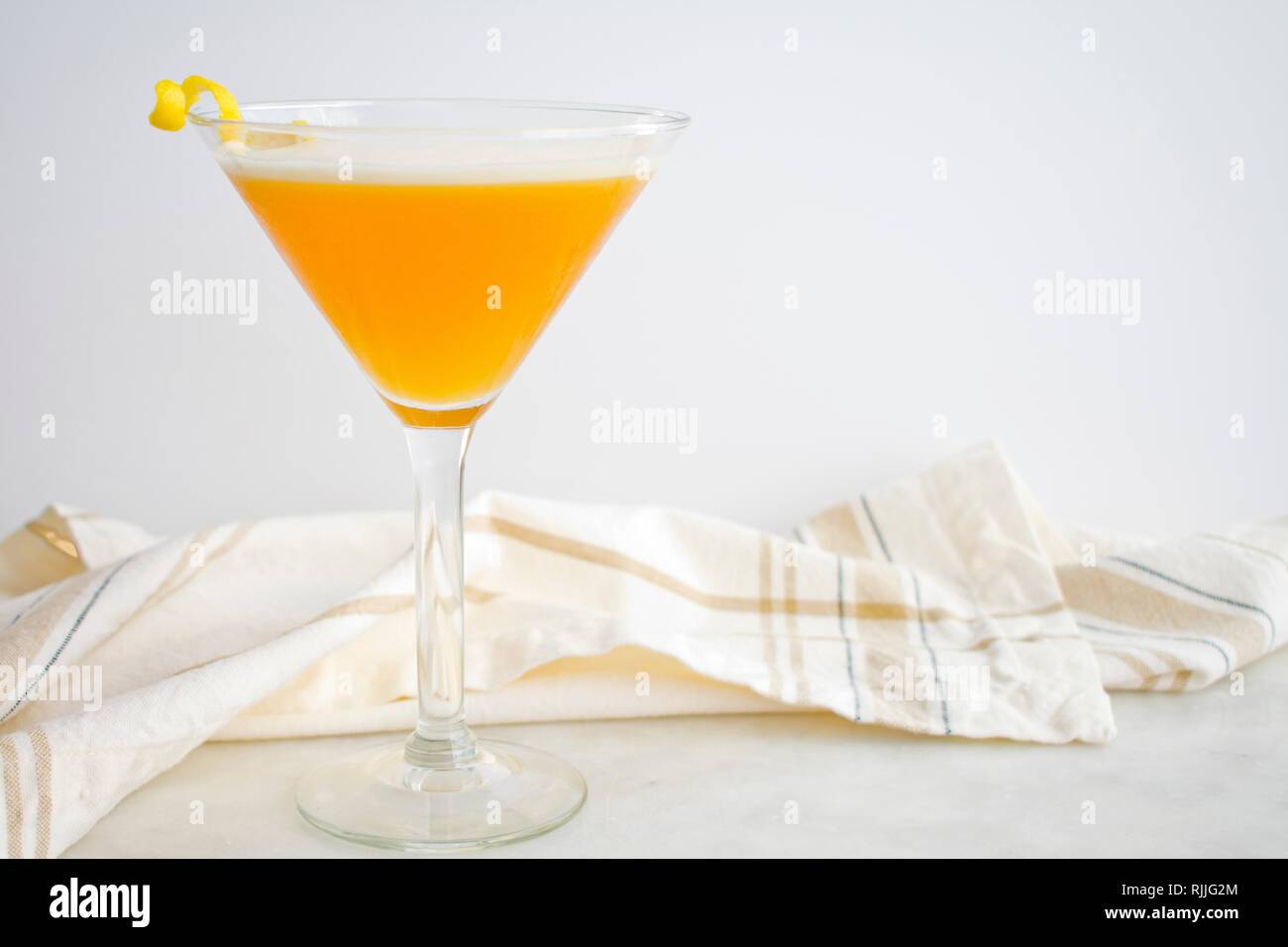 French Martini Garnished with a Lemon Twist Stock Photo Alamy