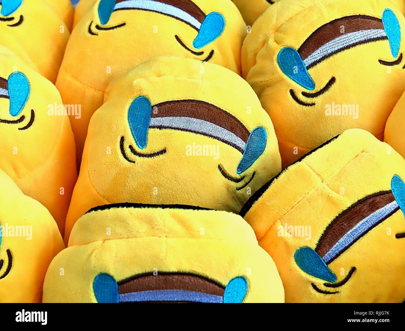 Funny yellow carpet slippers at a market Stock Photo