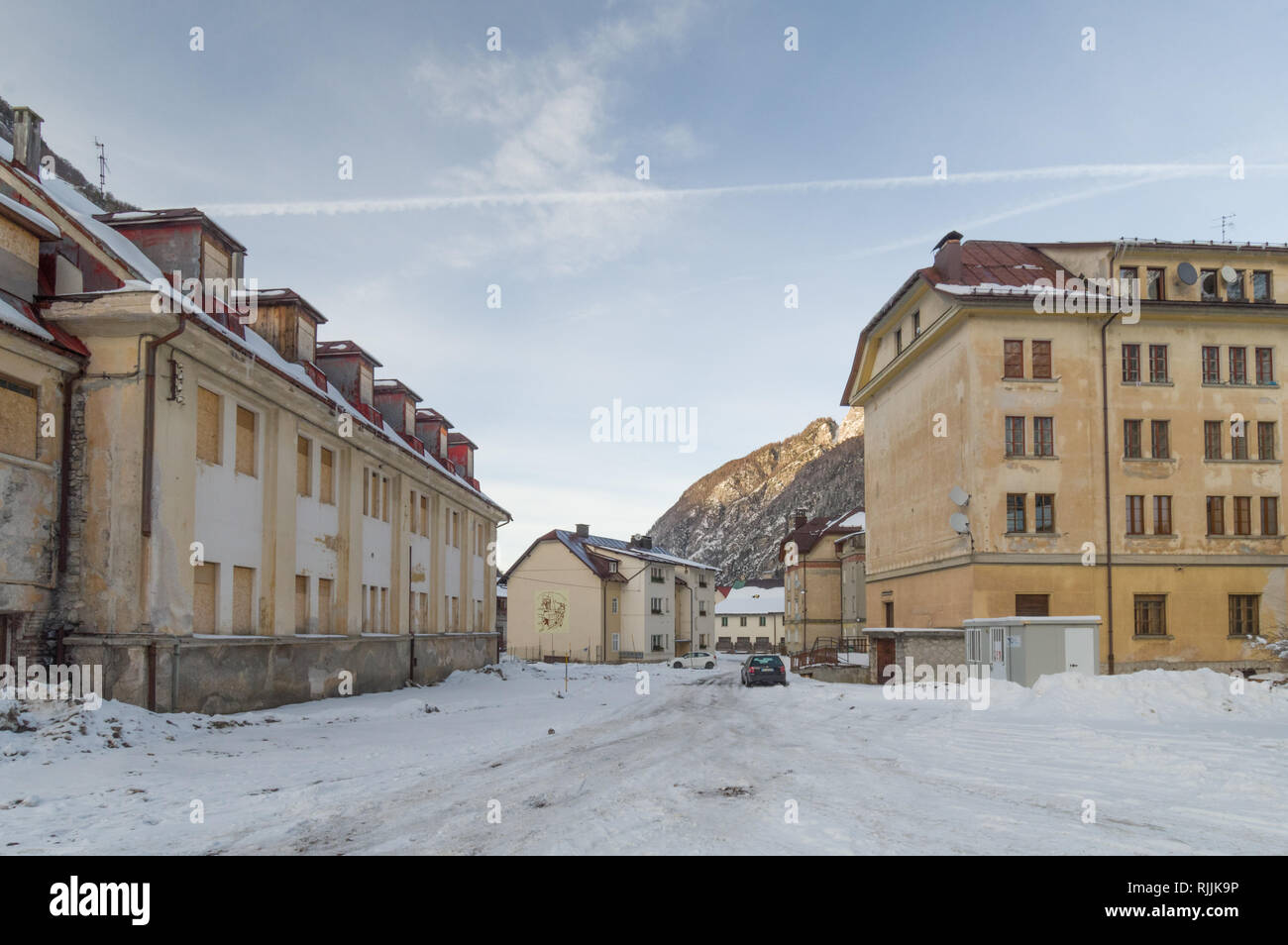 Cave del Predil, Italy (26th January 2019) - Old apartment buildings of the miners' families in the alpine mining town of Cave del Predil in winter Stock Photo