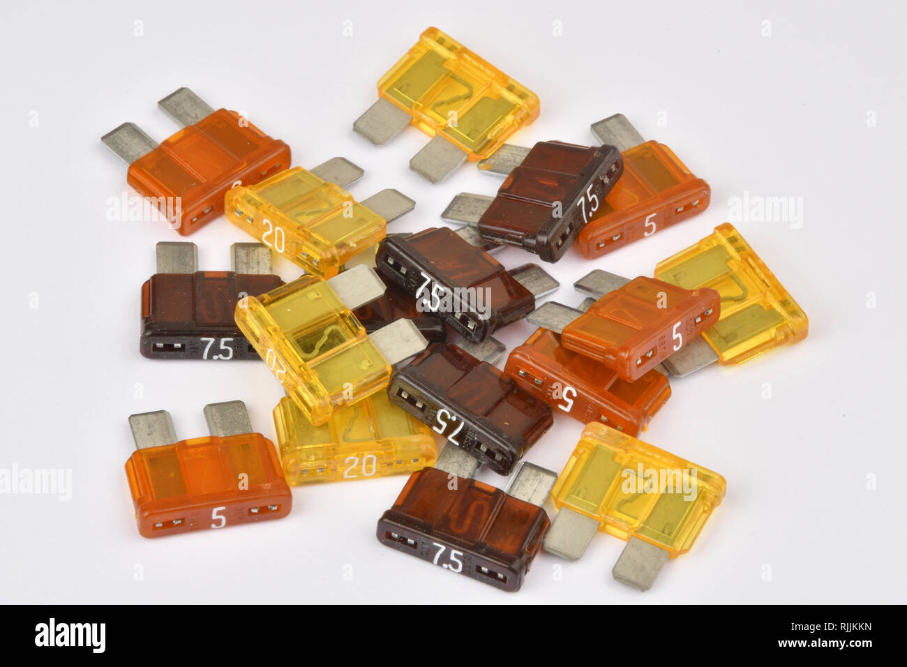 Blade type automotive fuses.A selection of ratings colour coded plastic bodies. Stock Photo