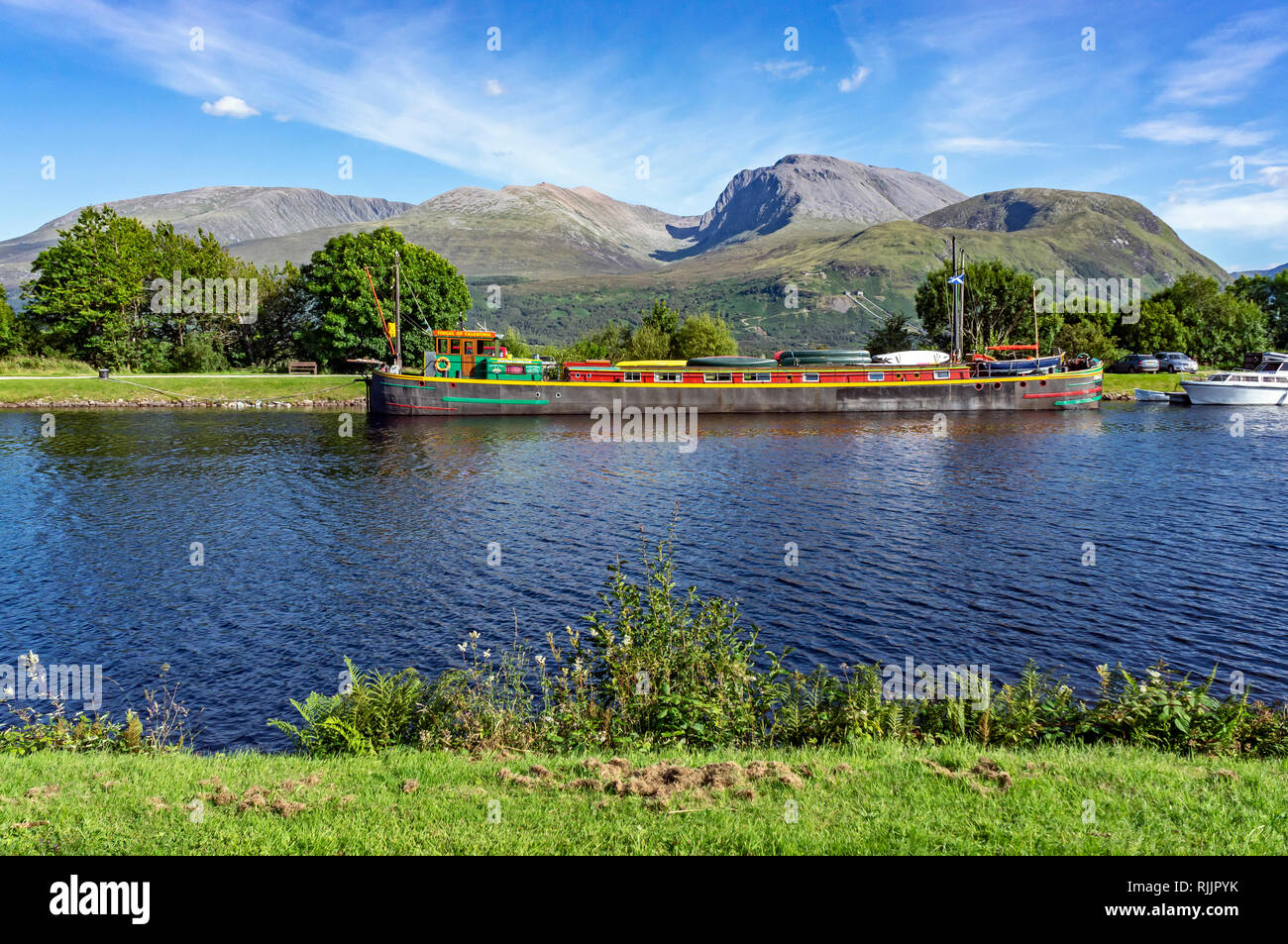 View of Scotland's highest mountain Ben Nevis from Banavie near Fort William Highland Scotland UK with cruising vessel Fingal of Caledonia moored Stock Photo
