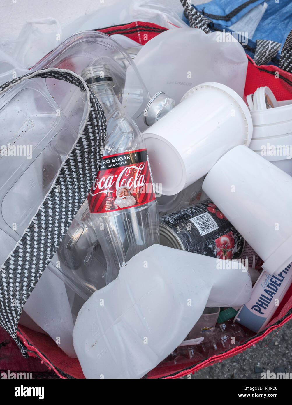Domestic plastics recycling bag outside house in Cornwall Stock Photo