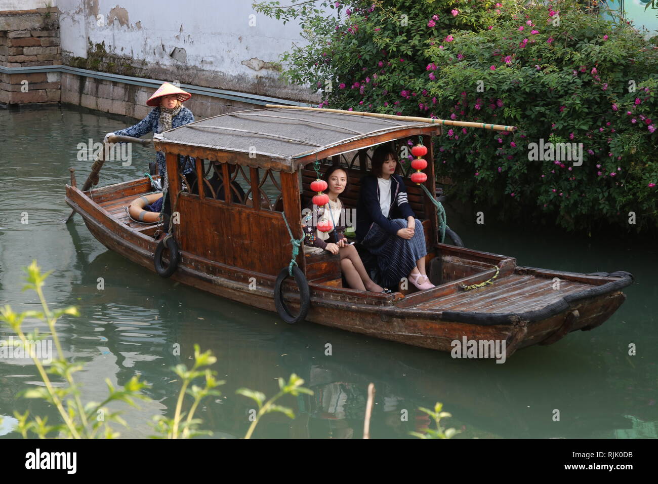 Suzhou, Jiangsu, Chinese traditional boat carrying elegant on a canal