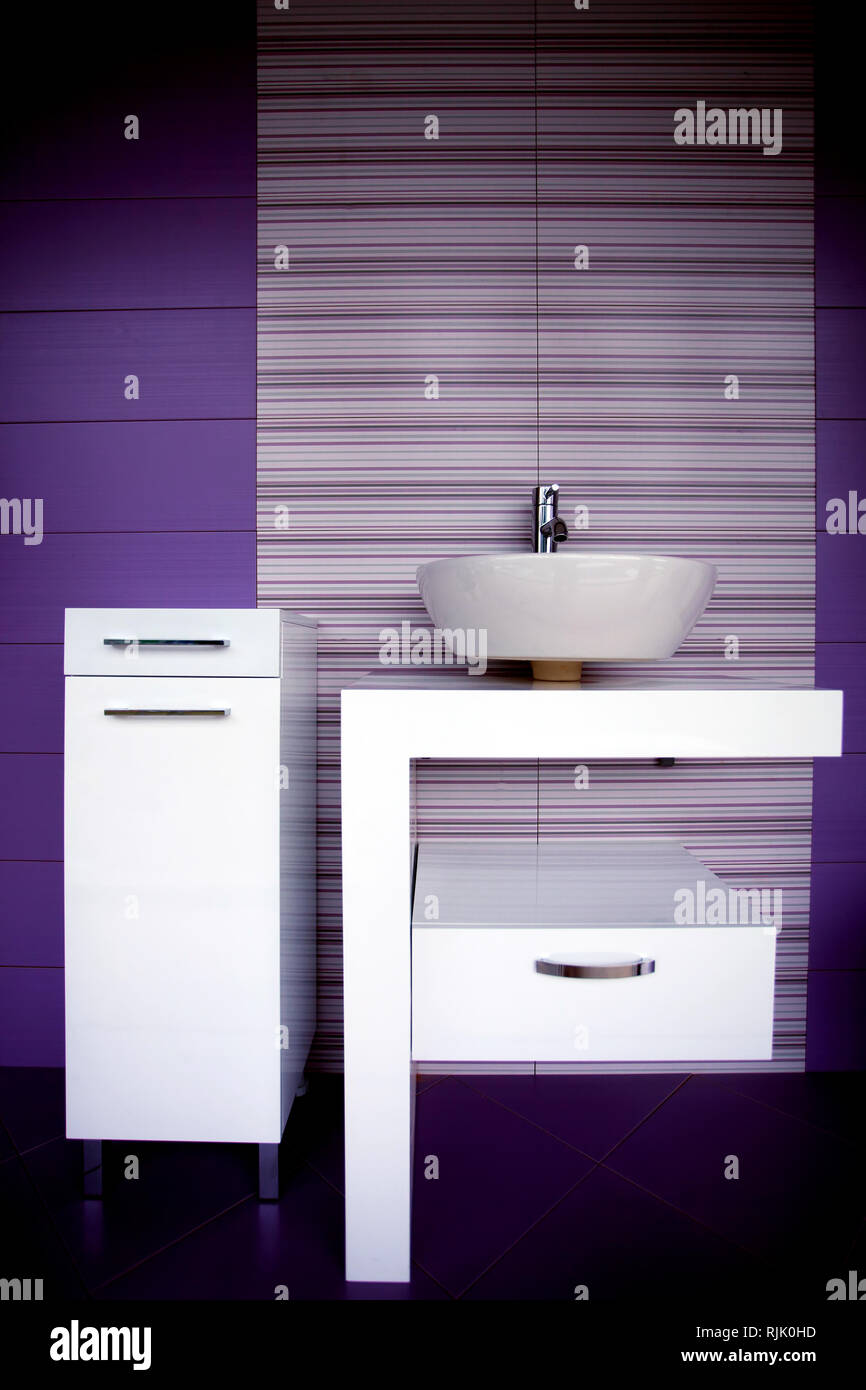 modern purpple and white bathroom details and furniture Stock Photo