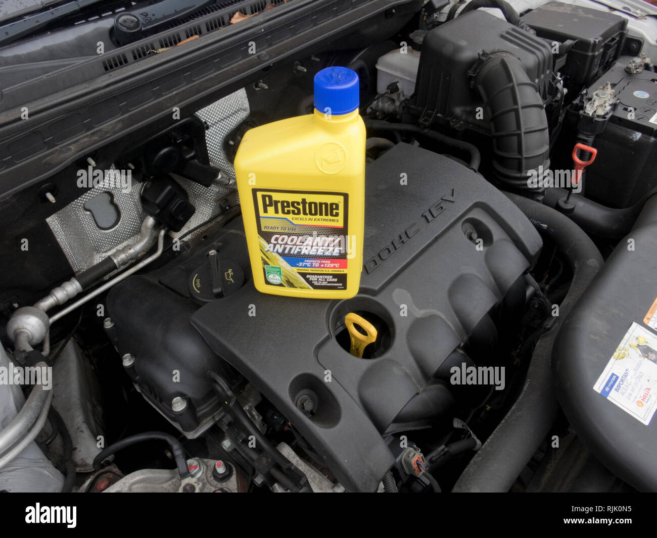 Prestone Engine Coolant or Anti Freeze on Top of a Car Engine Stock Photo
