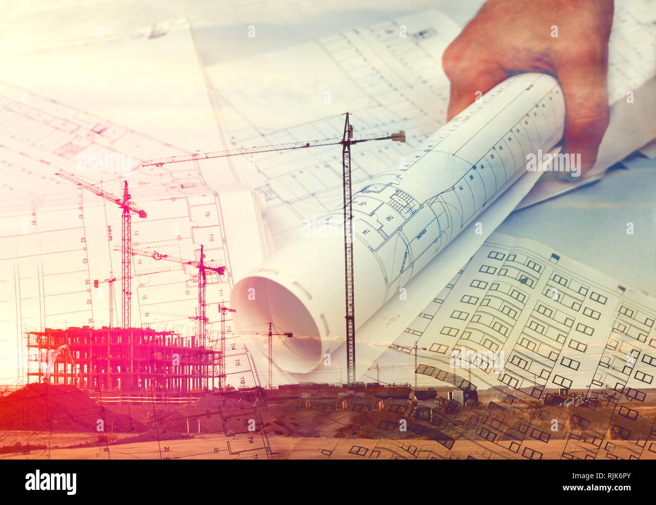 Cranes,buildings and construction concept.Architect and blueprint background Stock Photo