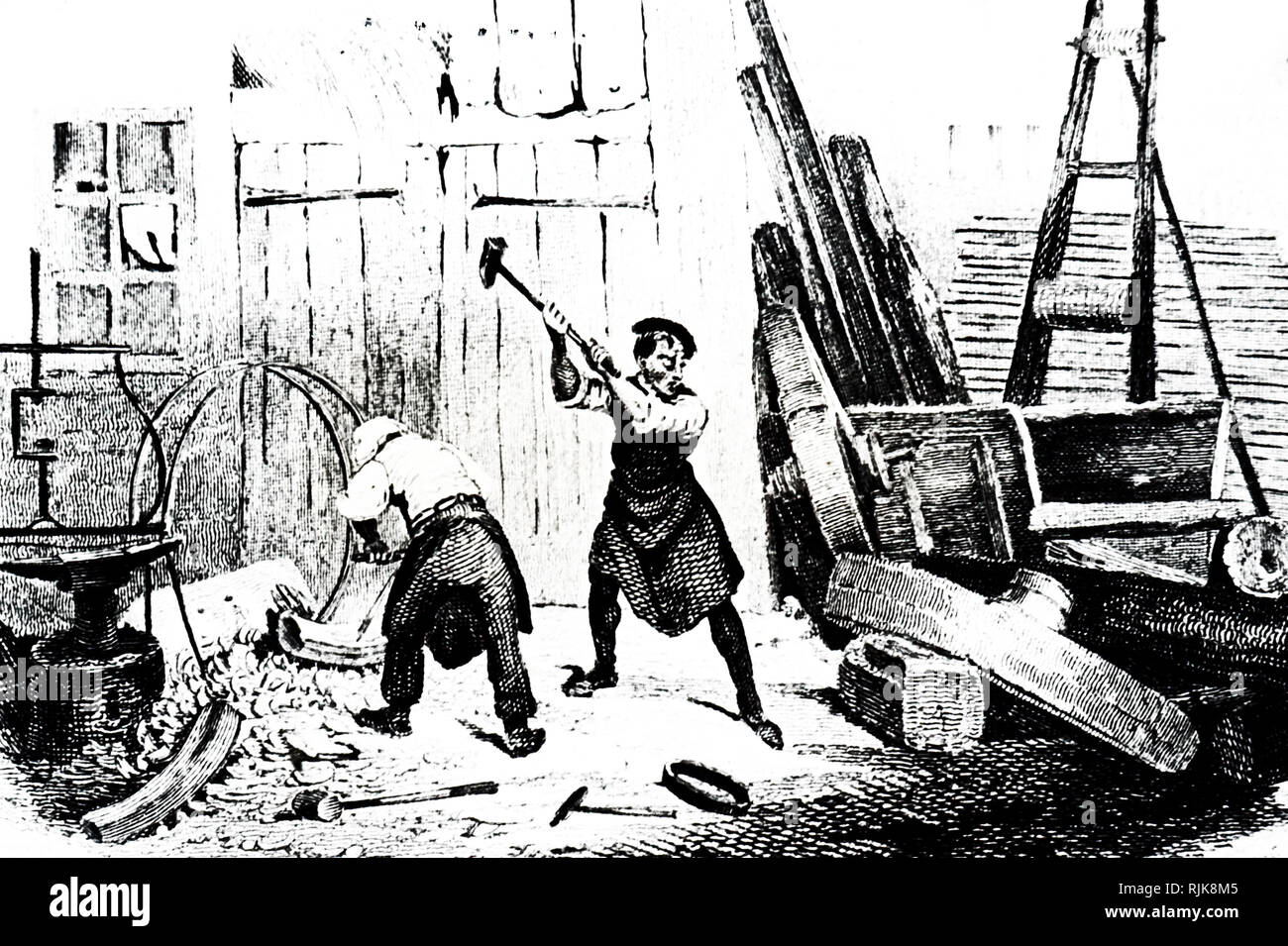 An engraving depicting wheelwrights. Dated 19th century Stock Photo Alamy
