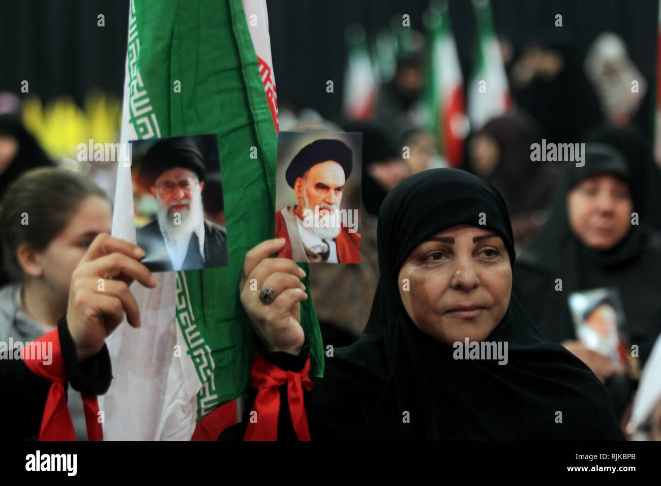 06 February 2019, Lebanon, Beirut: Supporters of Hezbollah, the pro-Iranian Lebanese Islamist political party and militant group, hold pictures of Ayatollah Khomeini, former Supreme Leader of Iran and leader of the 1979 Iranian Revolution, and Iran's current Supreme leader Ayatollah Ali Khamenei, during a rally to mark the 40th anniversary of the Iranian Islamic Revolution which toppled Mohammad Reza Pahlavi, the last Shah of Iran. Photo: Marwan Naamani/dpa Stock Photo