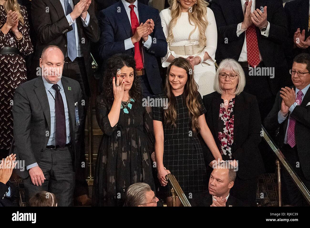 Washington, United States Of America. 05th Feb, 2019. Debra Bissell, Madison Armstrong and Heather Armstrong, who lost loved ones in a home invasion by a suspected illegal immigrant wave after being recognized by President Donald Trump during the State of the Union address to a joint session of Congress February 5, 2019 in Washington, DC. Credit: Planetpix/Alamy Live News Stock Photo