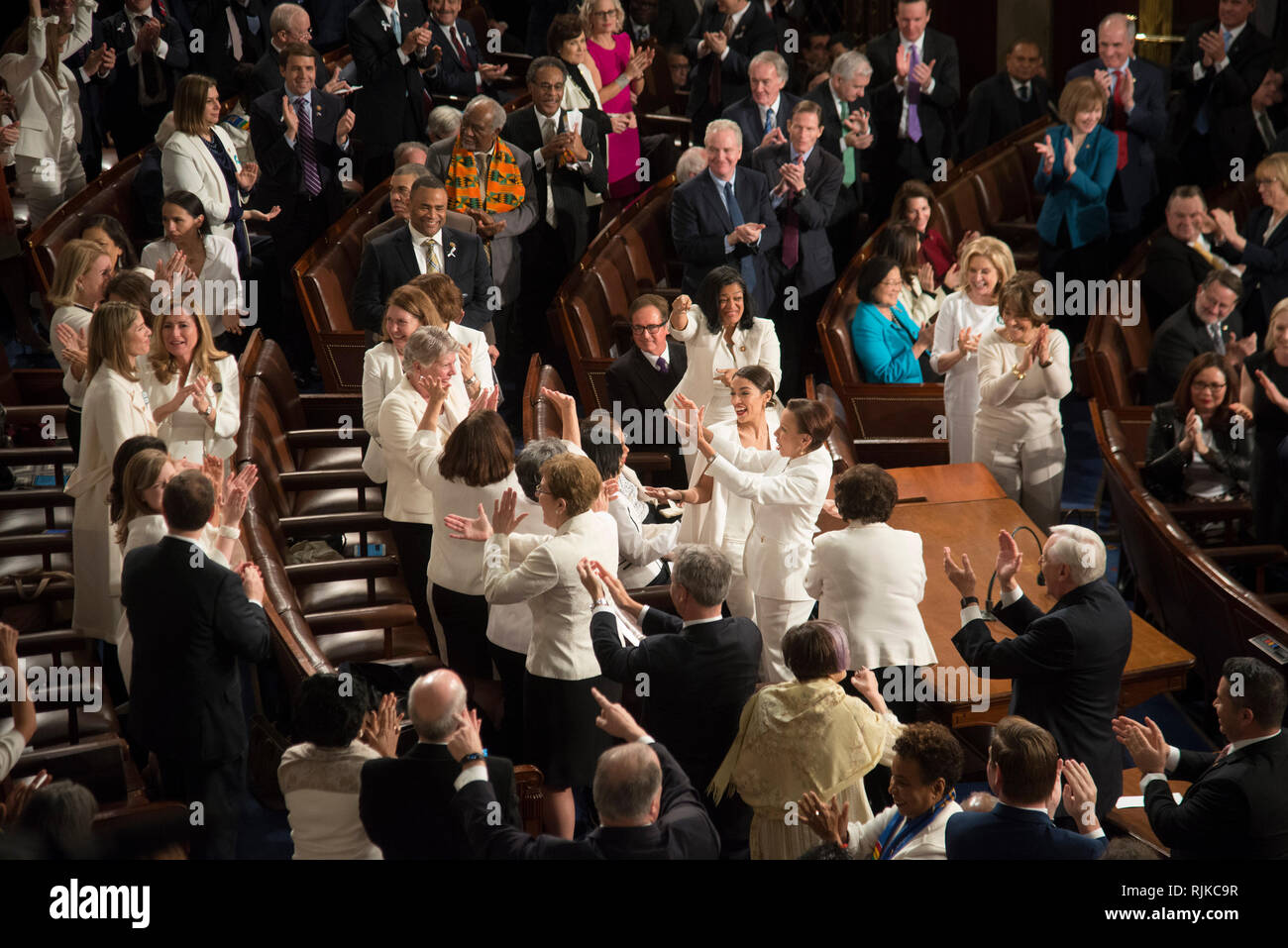 Washington, USA. 05th Feb, 2019. Washington DC, February 5, 2019, USA: Congressional Women Democrats take a moment to cheer earch other during President Donald J Trump second State of the Union (SOTU) address as President. House Speaker Nancy Pelosi and Vice President Mike Pence sit behind him in the US Capitol House of Representatives. Credit: Patsy Lynch/Alamy Live News Stock Photo