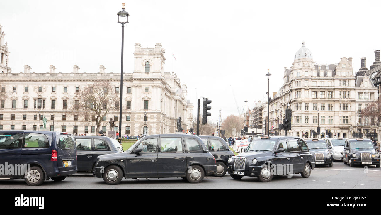 London, UK. 6th February, 2019. London cab drivers protest on Parliament Square today, against excluding the taxis from the busroute along Totenham Court Road, which the they fear is only the start for a complete taxi ban on all bus routes in the capital. Credit: Joe Kuis / Alamy Live News Stock Photo