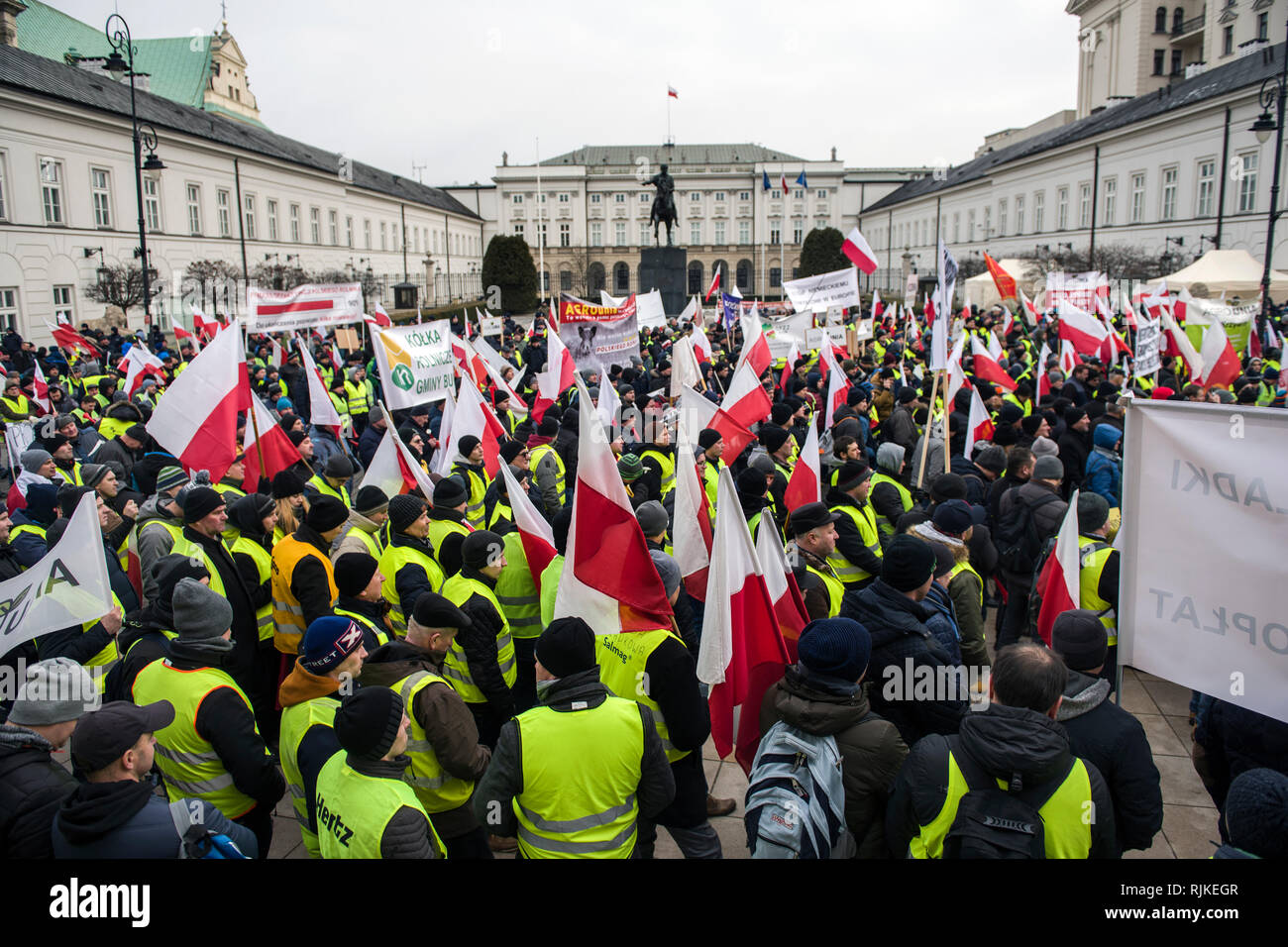 Thousands of farmers are seen holding flags and banners during the protest. Thousands of farmers from across Poland staged a protest outside the presidential palace in Warsaw, demanding repayment of various compensations, control and restrictions over the imports of agricultural products as well as an increase of purchase prices, The demonstration was held by the Agrounia group and had been billed by farmers as the 'Siege of Warsaw.' Farmers took a coffin for the president as a symbol of the death of the polish agriculture. Stock Photo