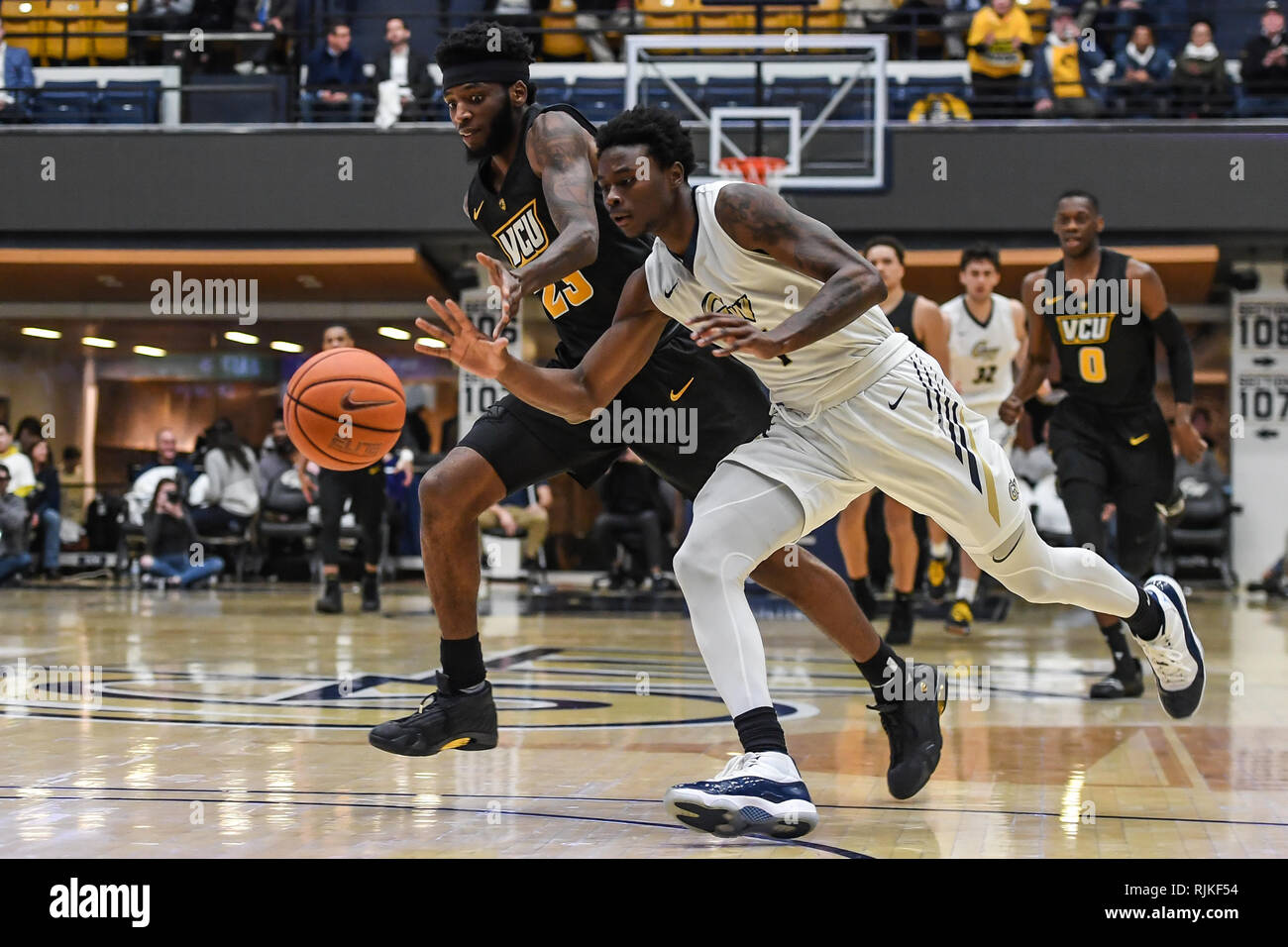 Washington, DC, USA. 11th Jan, 2016. ISSAC VANN (23) and TERRY NOLAN JR (1) fight for control over the basketball during the game held at the Charles E. Smith Center in Washington, DC. Credit: Amy Sanderson/ZUMA Wire/Alamy Live News Stock Photo