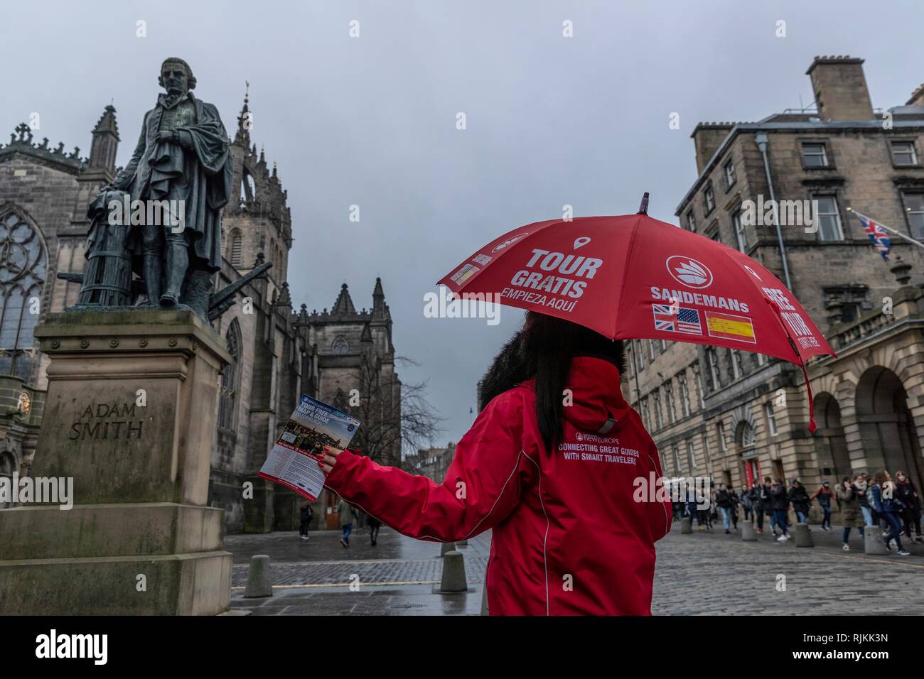 Edinburgh, UK. 07th Feb, 2019. Councillors in Scotland's capital city, Edinburgh, vote on proposals to introduce a tourist tax of £2 per person, per night. The proposals, if approved, will also need legislative change by the Scottish Government which was signalled in the recent Budget. Pictured: One of the many Free Tours sellers on Edinburgh's Royal Mile under a statue of free-market economist, Adam Smith Credit: Rich Dyson/Alamy Live News Stock Photo