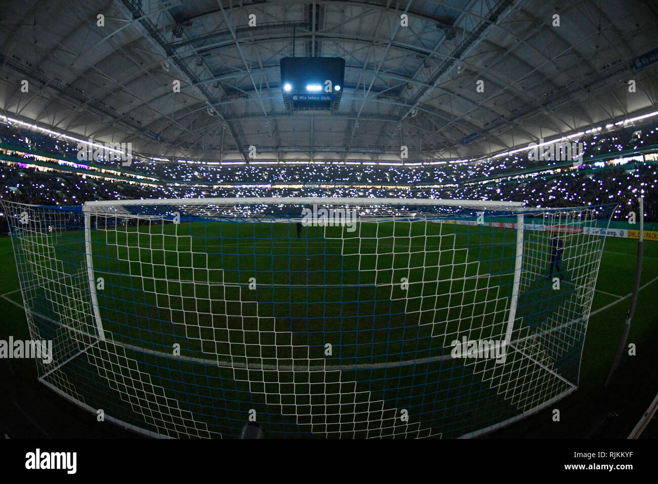Veltins-Arena Gelsenkirchen, Germany. 6th Feb, 2019. Football German Cup, DFB Pokal Season 2018/19 round of sixteen, Schalke 04 (S04) vs. Fortuna Dusseldorf (Duesseldorf) --- interior of Schalke Arena with closed roof, illuminated by mobile phone lights Stock Photo
