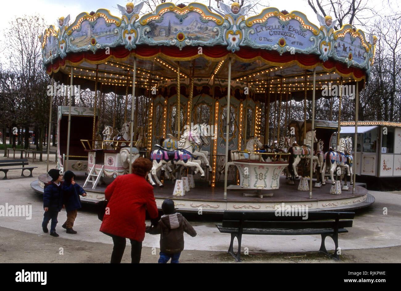 Antique carousel in park in Paris, France circa 1970s Stock Photo